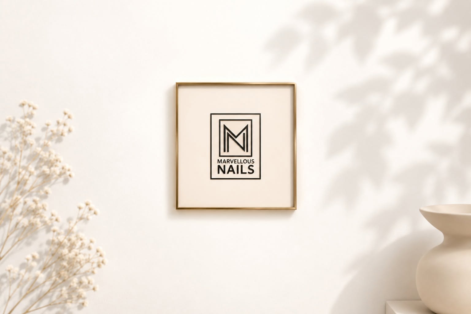 Marvellous Nails logo displayed in a framed wall mockup