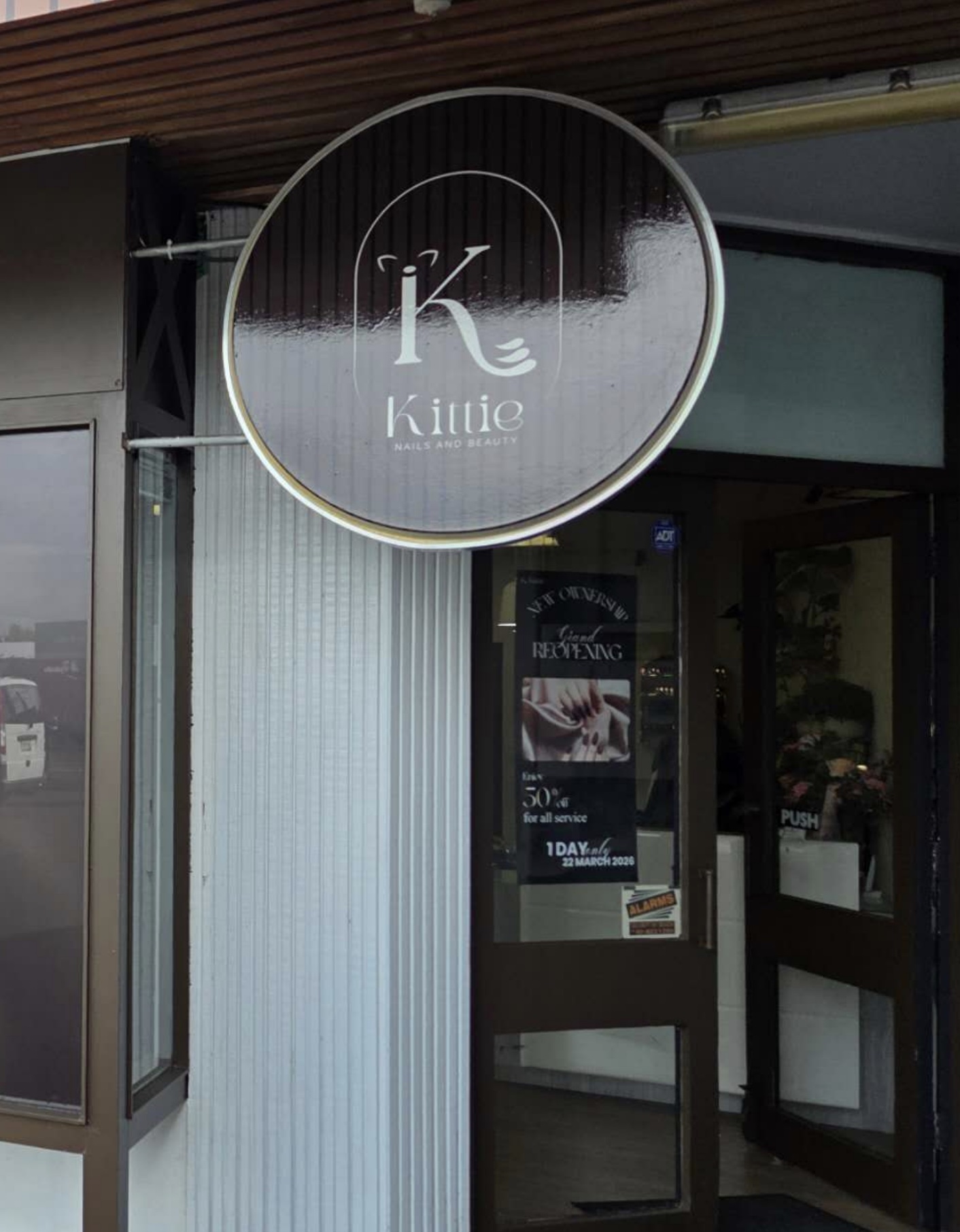 Kittie Nails and Beauty illuminated round sign